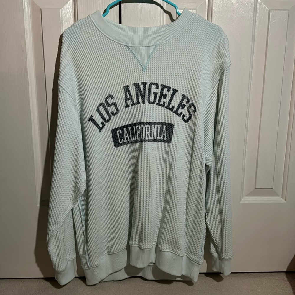 Light teal Aerie oversized “Los Angeles California” crewneck.